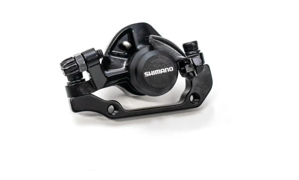 Гальмівний каліпер дисковий SHIMANO BR-TX805 Tourney TX задній з колодками і адаптером під 140/160мм Гальмівний каліпер дисковий SHIMANO BR-TX805 Tourney TX задній з колодками і адаптером під 140/160мм